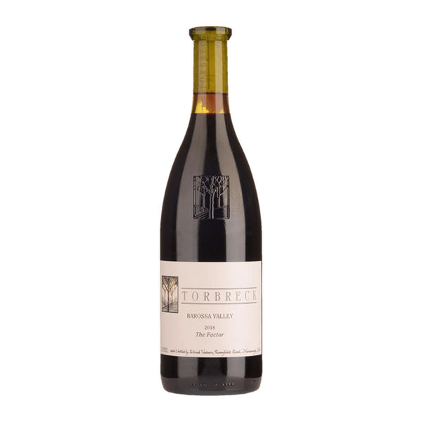 A bottle of Torbreck The Factor Shiraz 2018 wine with a label that includes the brand name and the name of the wine.