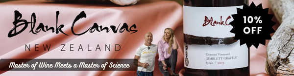 Blank Canvas New Zealand wine bottle with a discount label and couple in the background