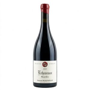 A bottle of Domaine Michel Nollart Echezeaux Grand Cru red wine, featuring a dark glass bottle with a white label and a red wax seal on the neck, set against a plain white background.
