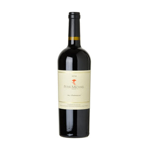 Wine bottle with 'Peter Michael' label on a white background